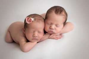 newborn photographer in rochester ny captures newborn twins sleeping together