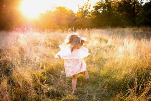 family photographer in rochester ny captures little girl dancing