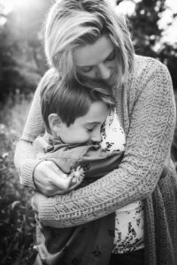 family photographer in rochester ny captures mom hugging her son
