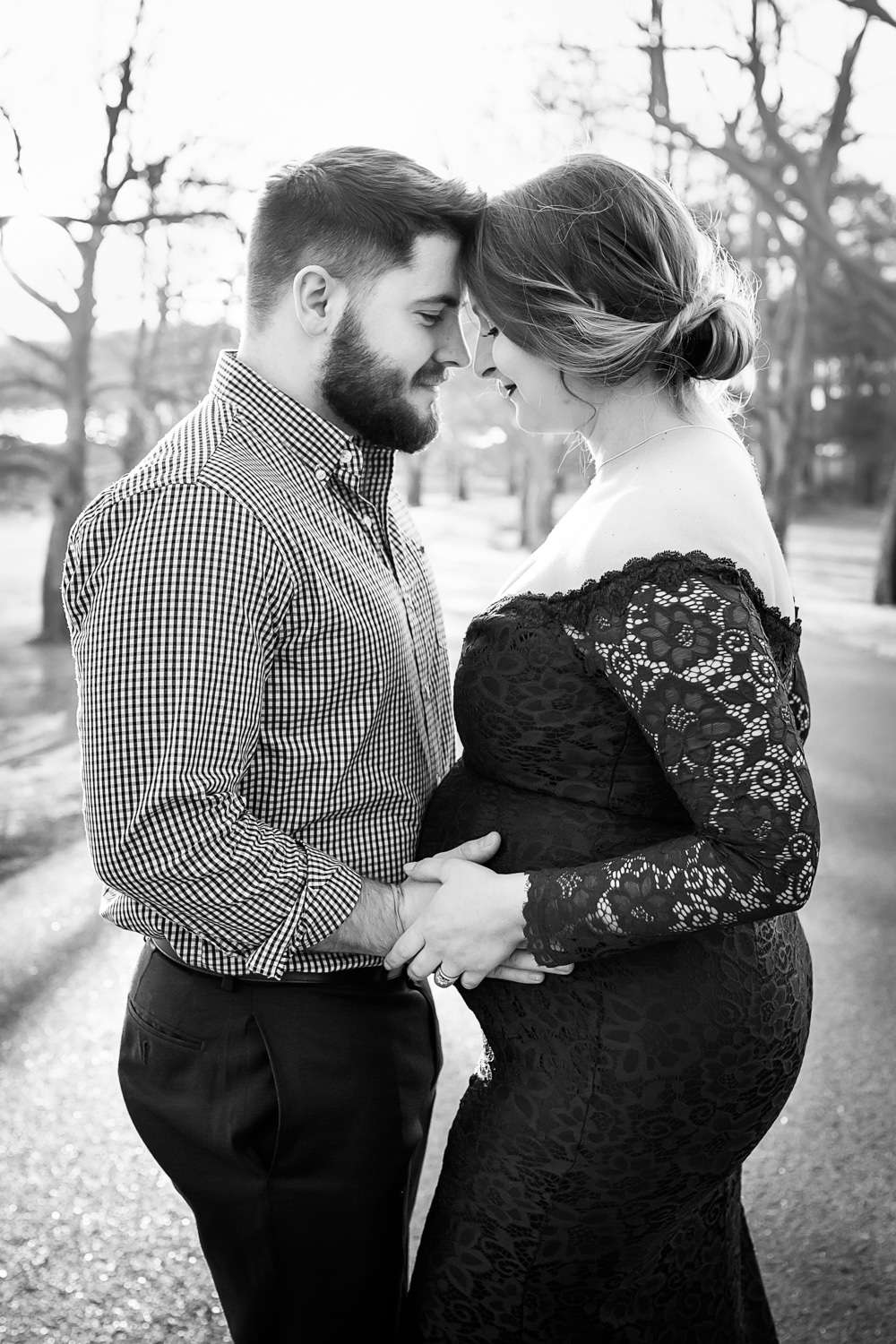 maternity photographer in rochester ny captures pregnant mom and dad waiting on baby