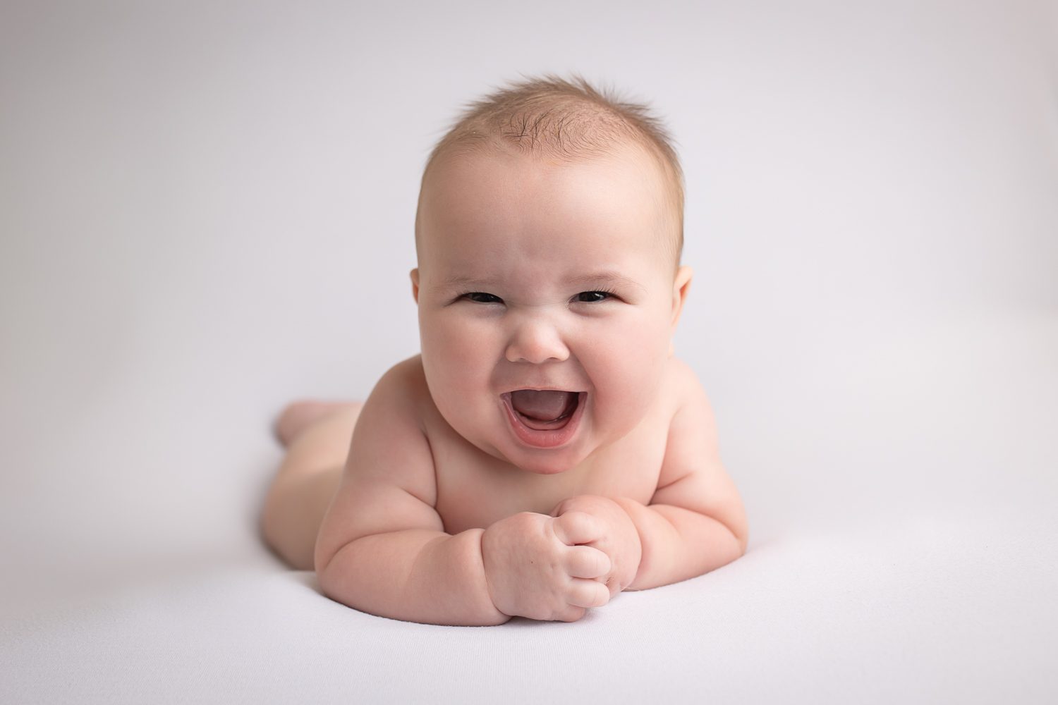 baby photographer in rochester ny captures baby boy smiling