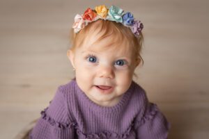 baby photographer in rochester ny captures baby girl smiling