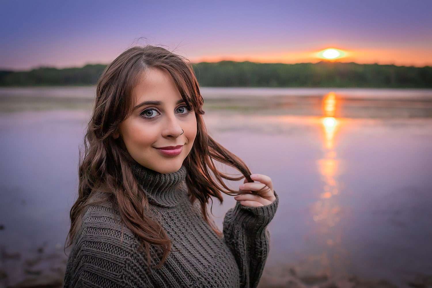family photographer in rochester ny captures senior portraits on the water at sunset