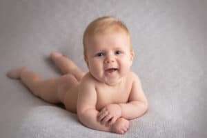 baby photographer in rochester ny captures milestone photography session of 4 month old baby boy doing tummy time