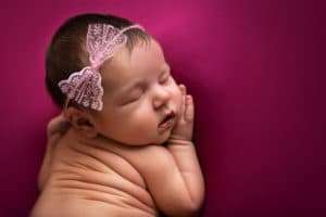 newborn photographer in rochester ny captures newborn baby girl sleeping 