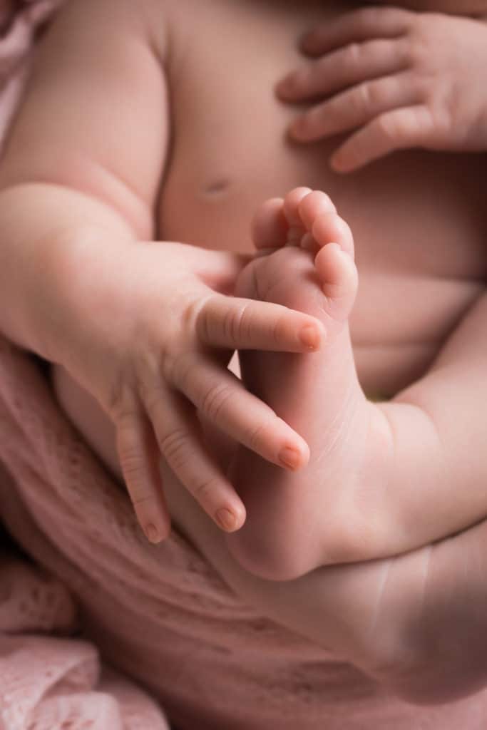 newborn photographer in rochester ny captures newborn baby girl sleeping