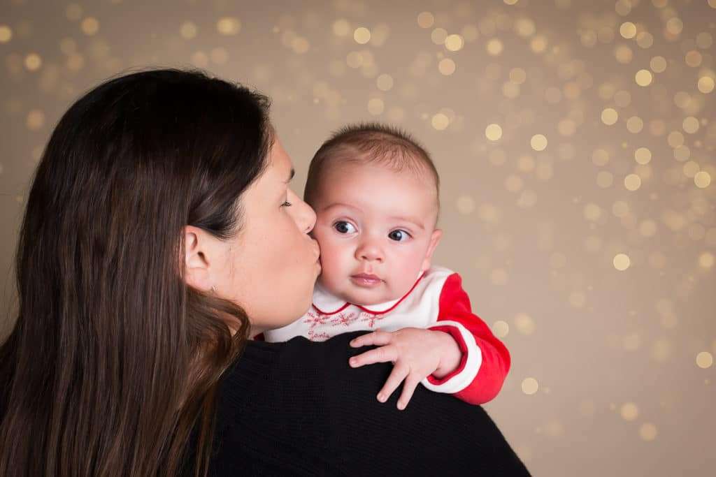 family photographer in rochester ny captures family christmas portraits during christmas mini sessions in her studio