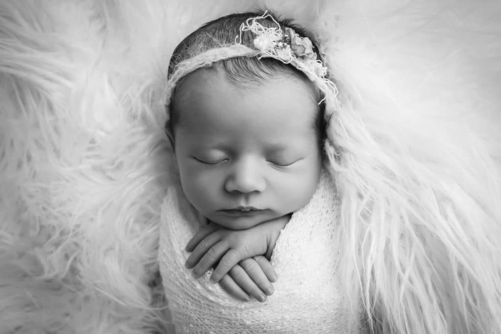 newborn photographer in rochester ny captures newborn baby sleeping