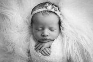newborn photographer in rochester ny captures newborn baby sleeping