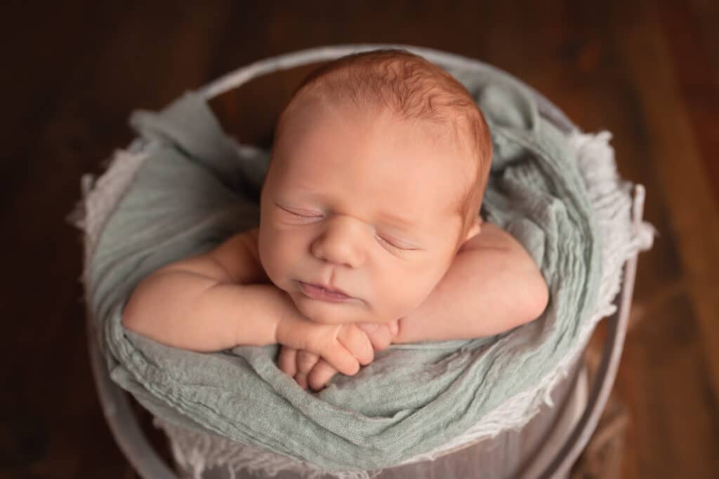 newborn photographer in rochester ny captures baby boy sleeping