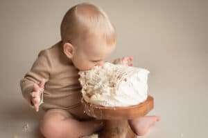 newborn photographer in rochester ny captures cake smash for baby's first birthday