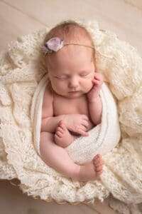 newborn photographer in rochester ny captures sleeping newborn baby