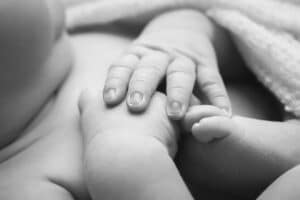 newborn photographer in rochester ny captures sleeping newborn baby