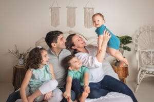 family photographer in rochester ny captures family smiling together in fairport ny