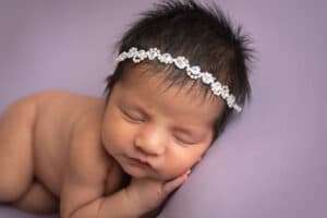 newborn photographer in rochester ny captures baby girl sleeping