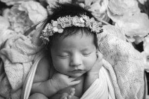 newborn photographer in rochester ny captures baby girl sleeping