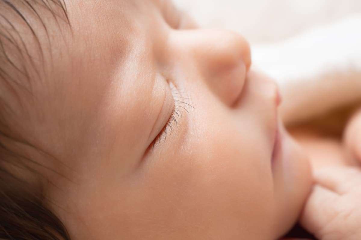 newborn photographer in rochester ny captures macros image of newborn baby girl's eyelashes