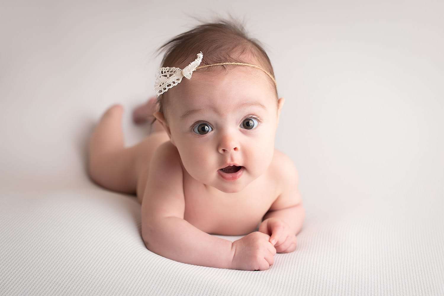 baby photographer in rochester ny captures baby's first year from newborn photography to cake smash