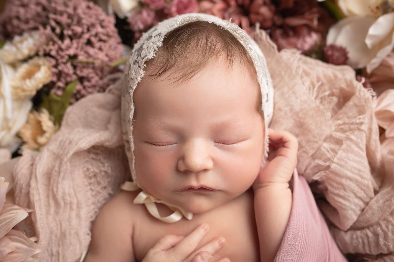 newborn photographer in rochester ny captures newborn baby girl sleeping