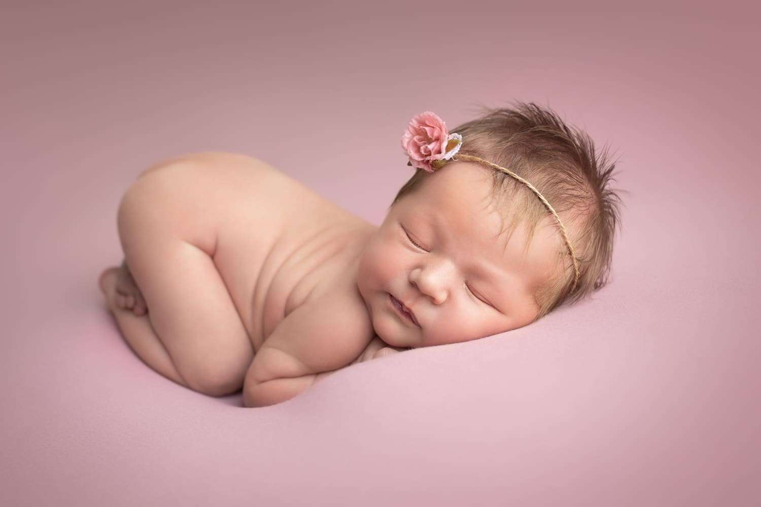 newborn photographer in rochester ny captures newborn baby girl sleeping in bum up pose