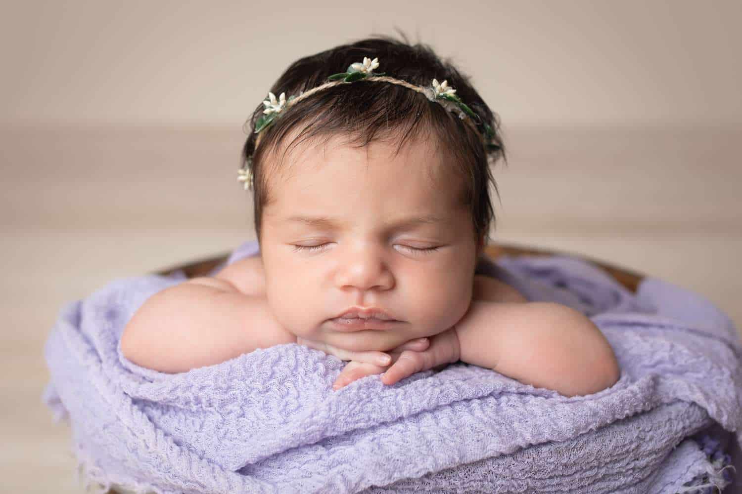 newborn photographer in rochester ny captures newborn baby girl chin on hands
