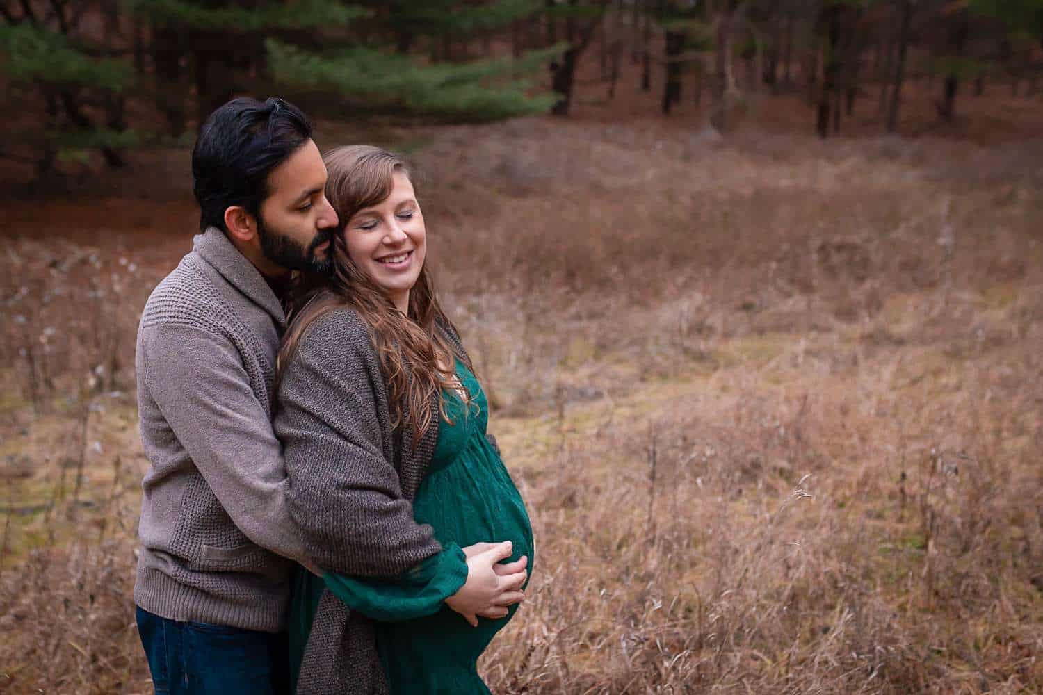maternity photographer in rochester ny captures sunset maternity portraits of mom to be