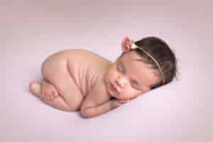 newborn photographer in rochester ny captures newborn baby girl in bum up pose