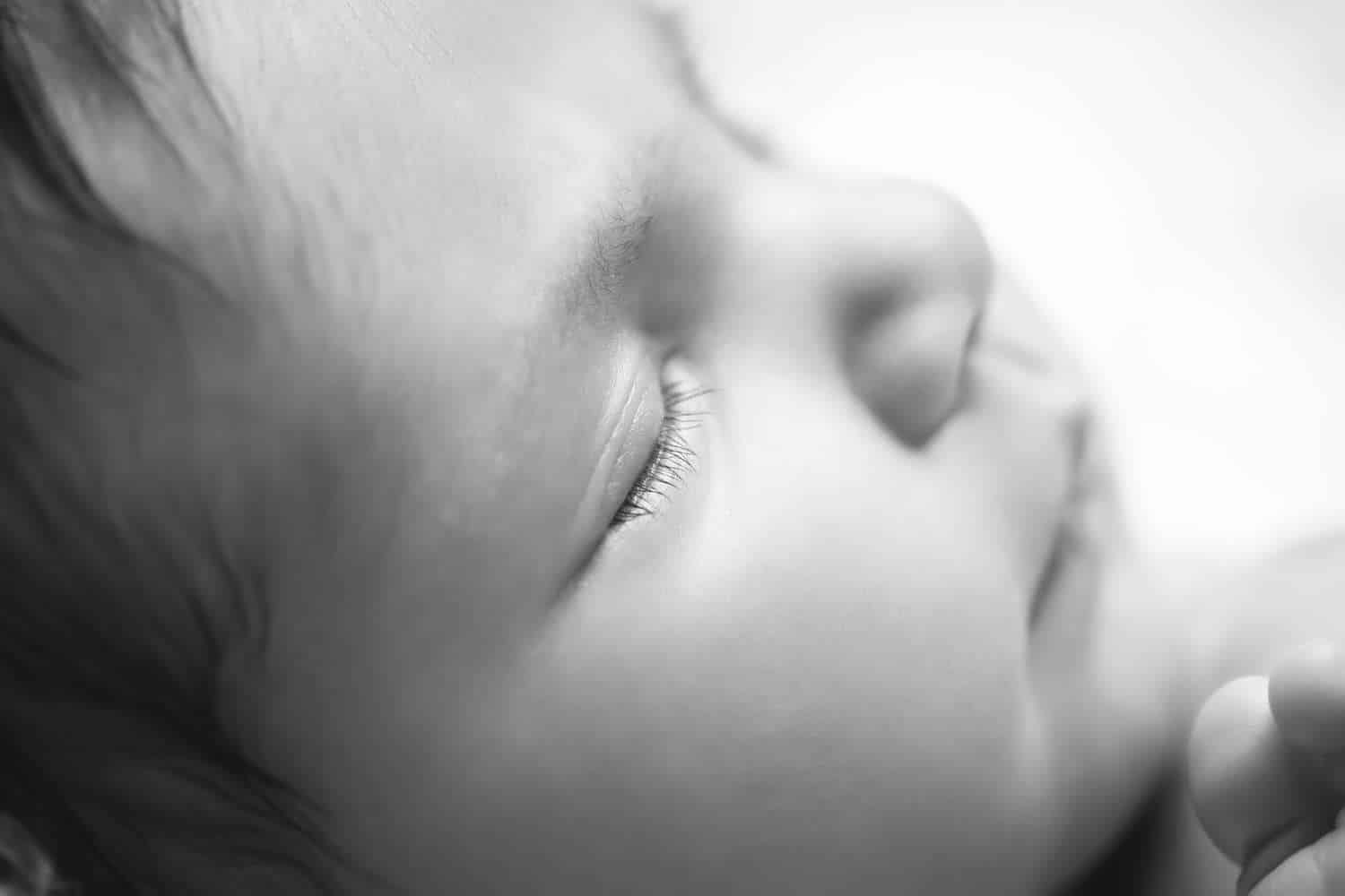 newborn photographer in rochester ny captures macros image of a newborn baby girl's eyelashes