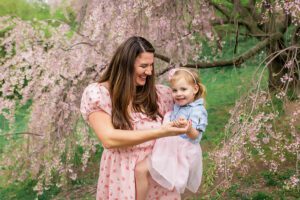 family photographer in rochester ny captures mom and daughter dancing